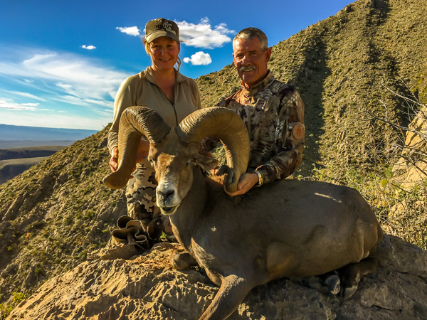 Hunting Couple with Trophy Desert Bighorn Ram